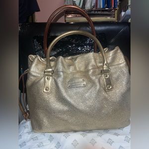 Kate spade gold shimmery drawstring bag